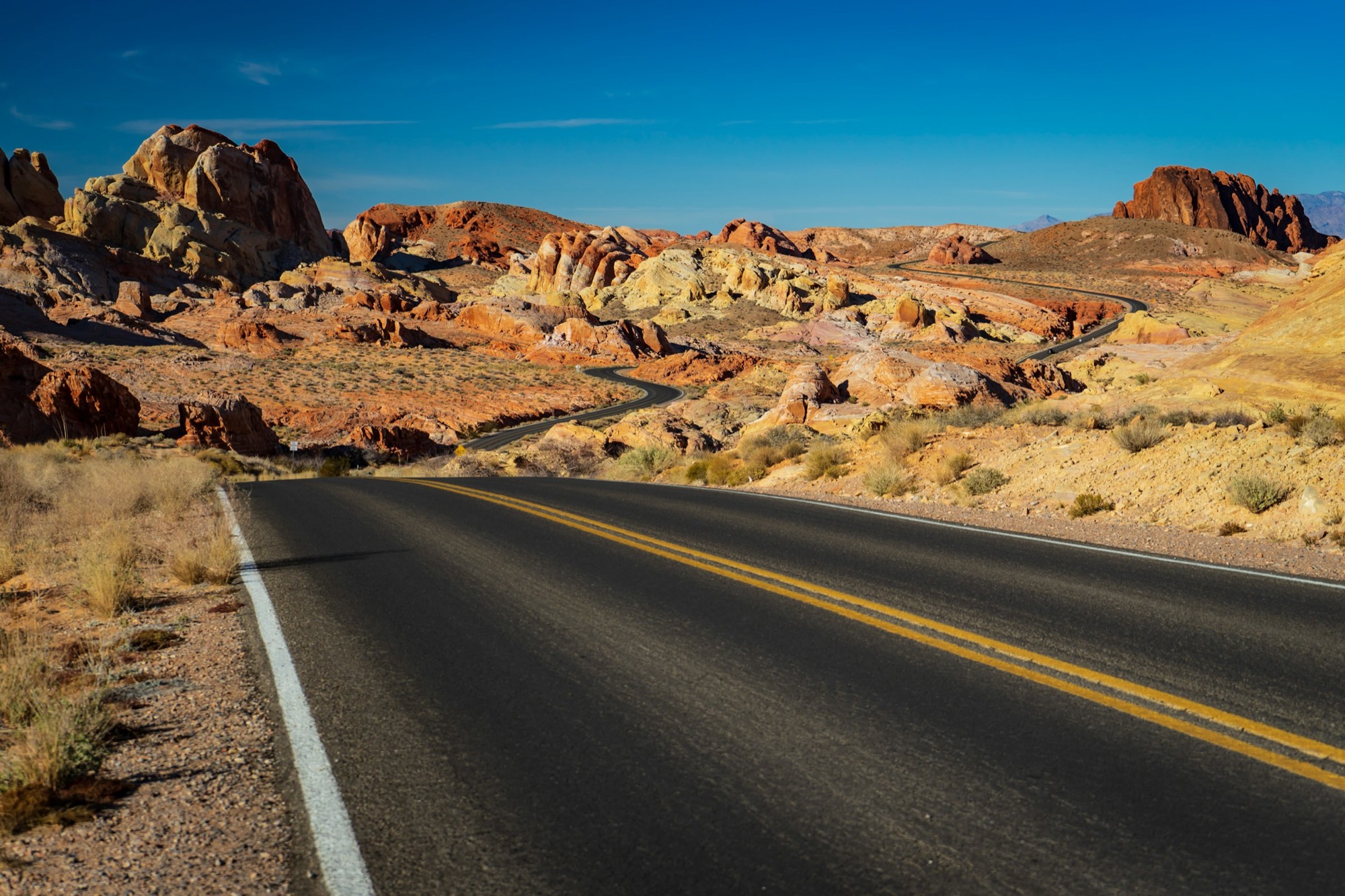 Desert highway through red rock in Nevada
